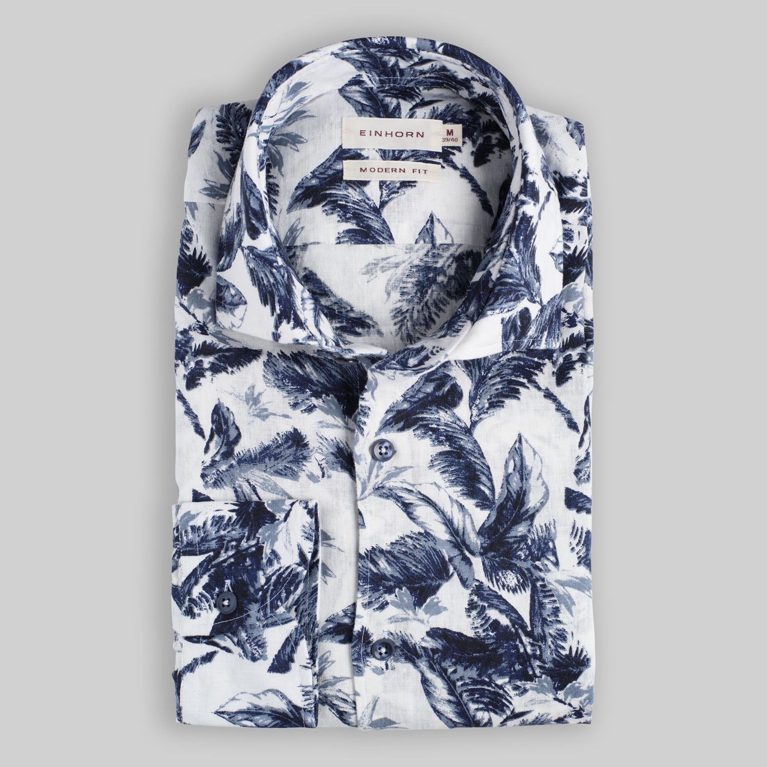 Das Einhorn Hemd Modern Fit Palmendruck Blau ist ein Ausdruck moderner Lässigkeit mit natürlichem Stilgefühl.